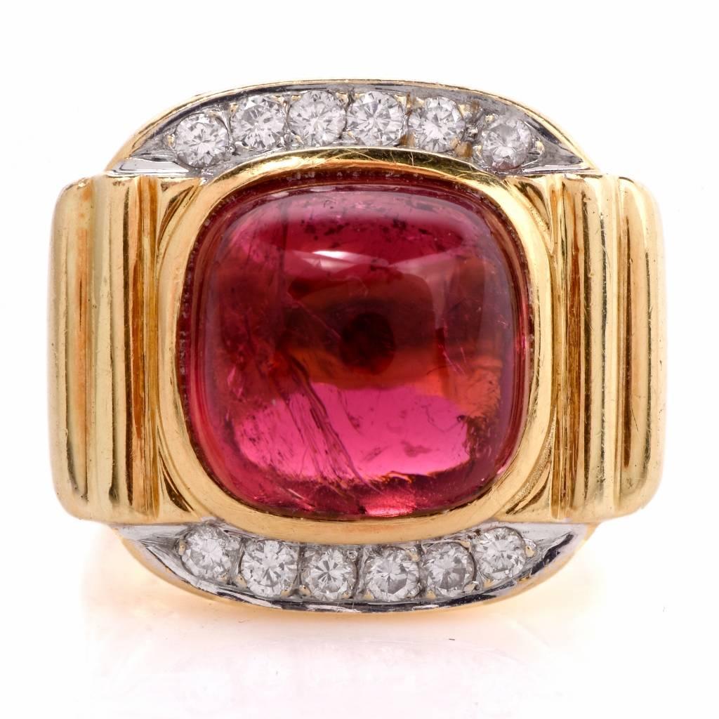 This lovely Cocktail ring is finely crafted in solid 18K yellow gold. This fashionable ring features one genuine cabochon tourmaline approx. 8.99 ct, topped with 12 round diamonds approx. 0.55cts, G-H color VS1-VS2 clarity, remains in excellent