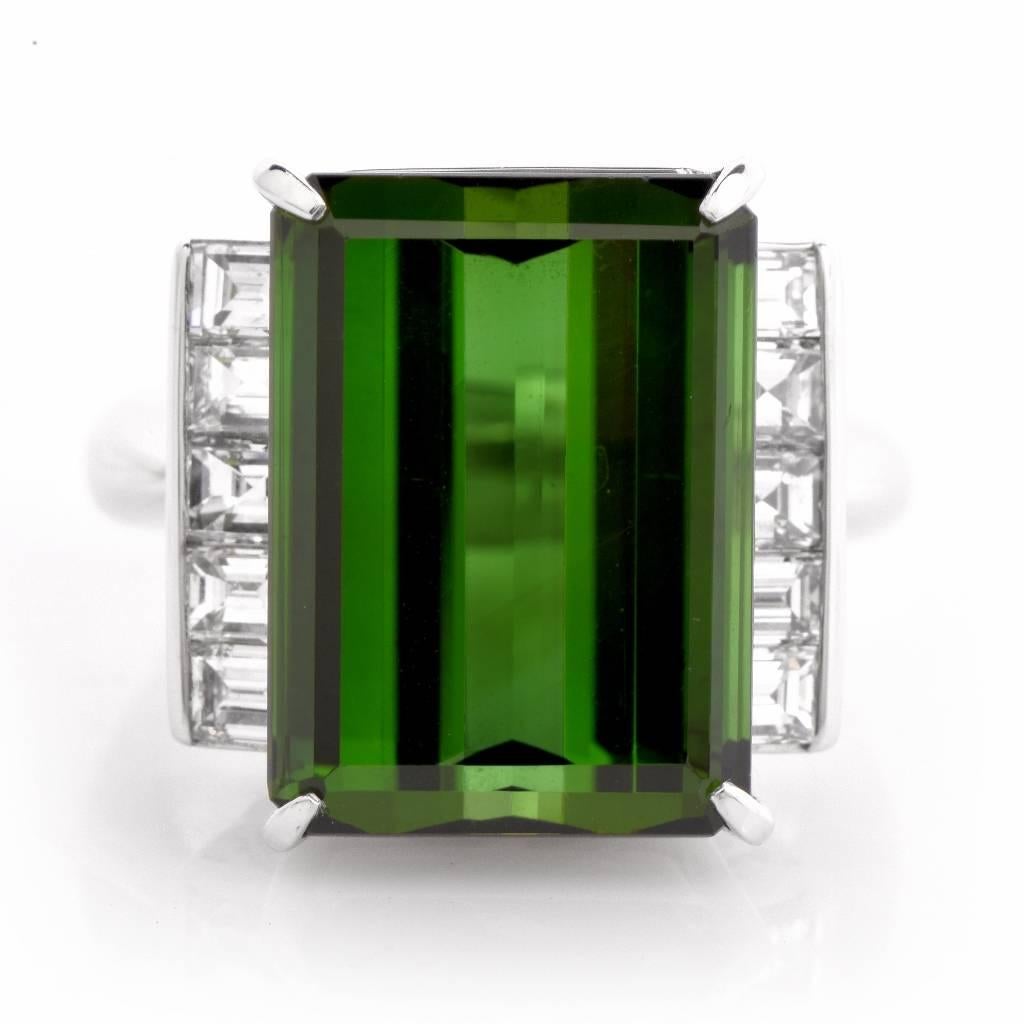 This fabulous Estate Solid Platinum ring is centered with 1 genuine Emerald cut green very fine Tourmaline approx: 14.82cttw, prong set and adorned on the sides with 10 genuine square cut Diamonds approx: 1.21cttw, F-G color, VS1-VS2 clarity,