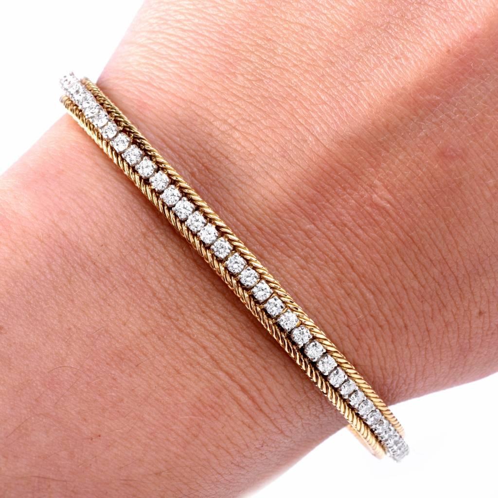 This alluring Hammerman Brothers bracelet Circa 1970's is crafted in solid 18K yellow gold with platinum applied to the entire setting of diamonds. Designed as a refined line bracelet, is adorned with  77 round diamonds approx 3.85cts, graded F-G
