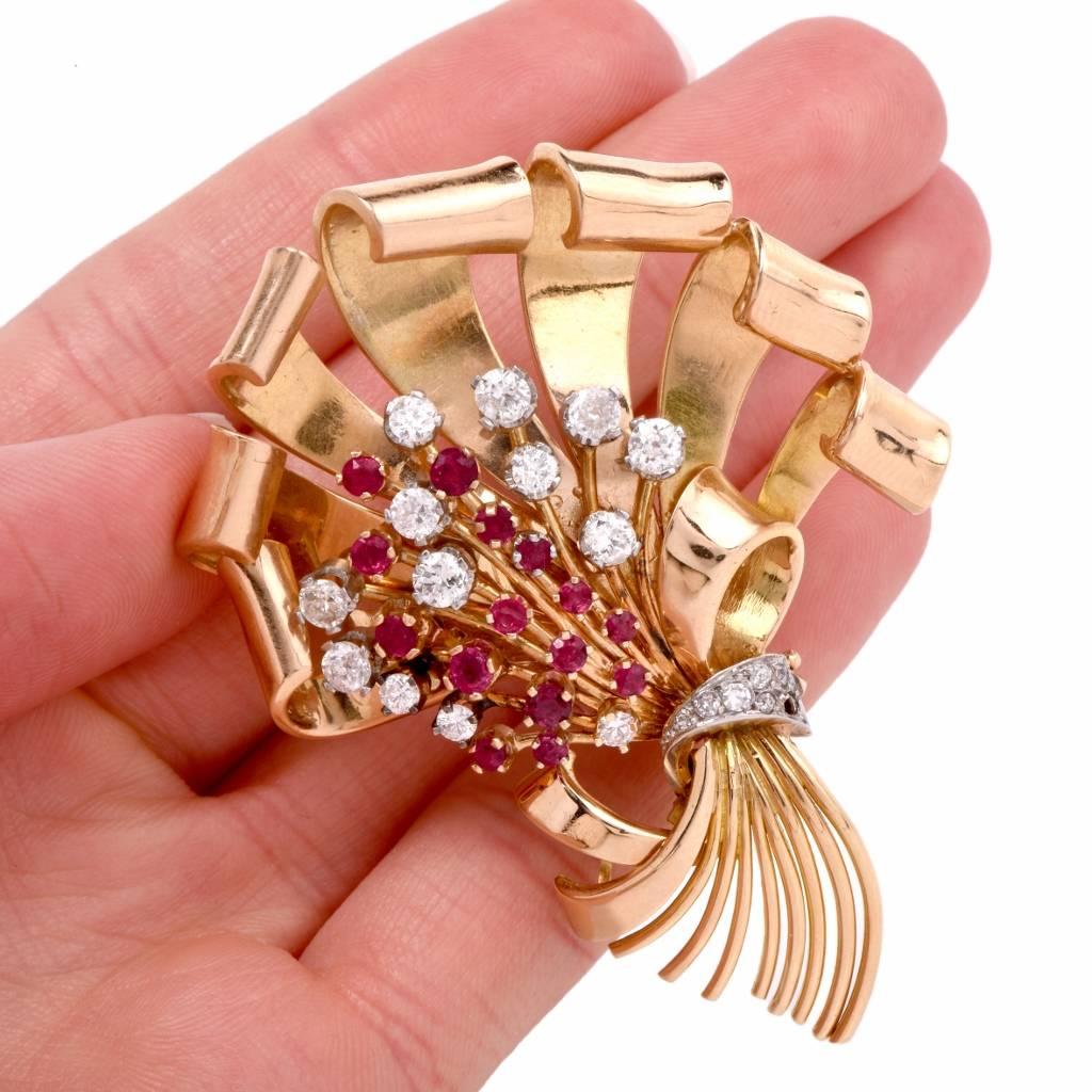 This elaborately detailed vintage Retro Brooch pin crafted in solid 18K rose gold simulates a vivacious flower bouquet. The bundle of flowers consists of round-faceted rubies and diamonds, against a background of romantically designed rose gold