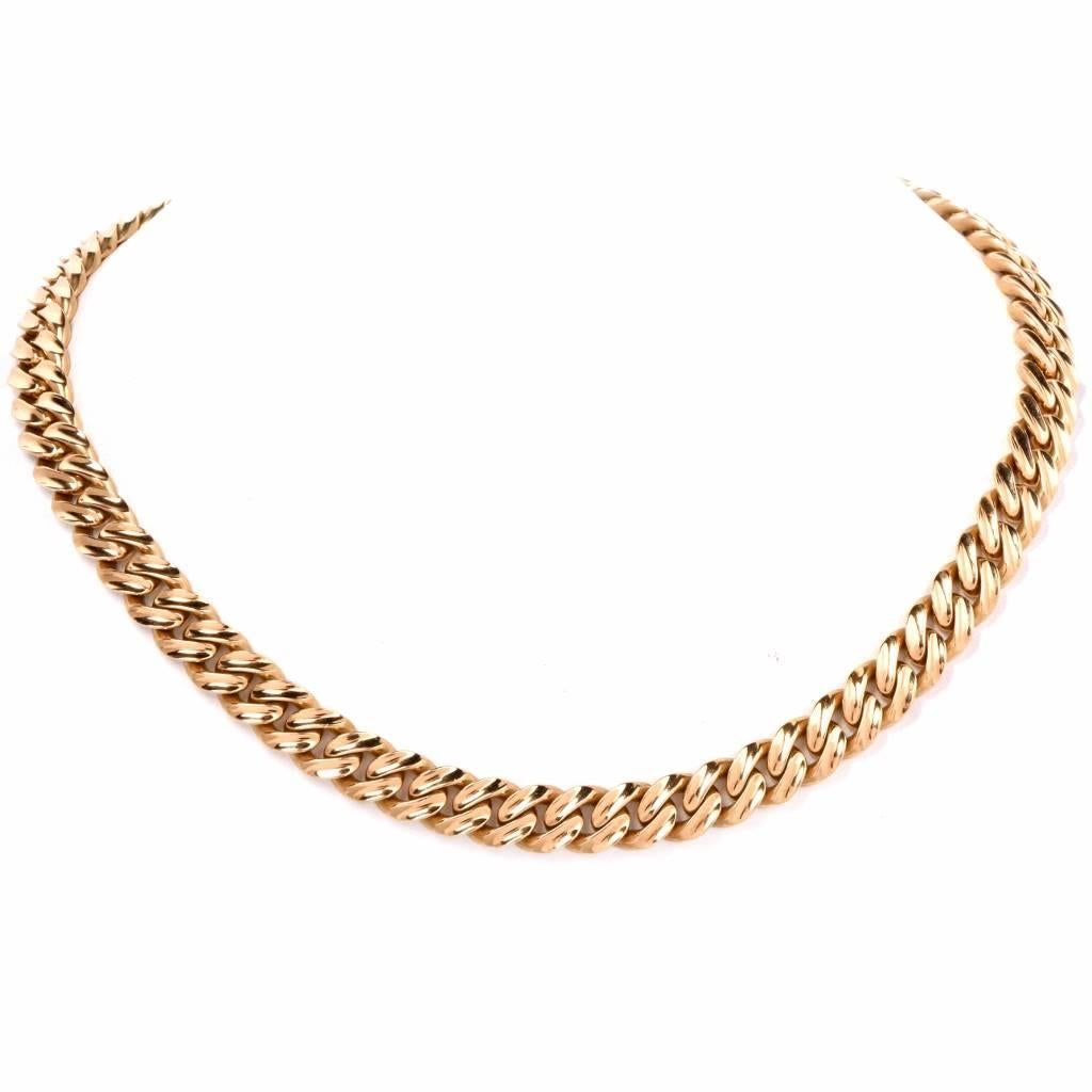 This vintage circa 1980'S Italian Heavy cuban curb link chain necklace is crafted in solid 18 yellow gold. It weighs 128.00 grams and measures 17.2 inches long and 9 mm wide. Composed of handcrafted interlocking flat Cuban curb links with an elegant