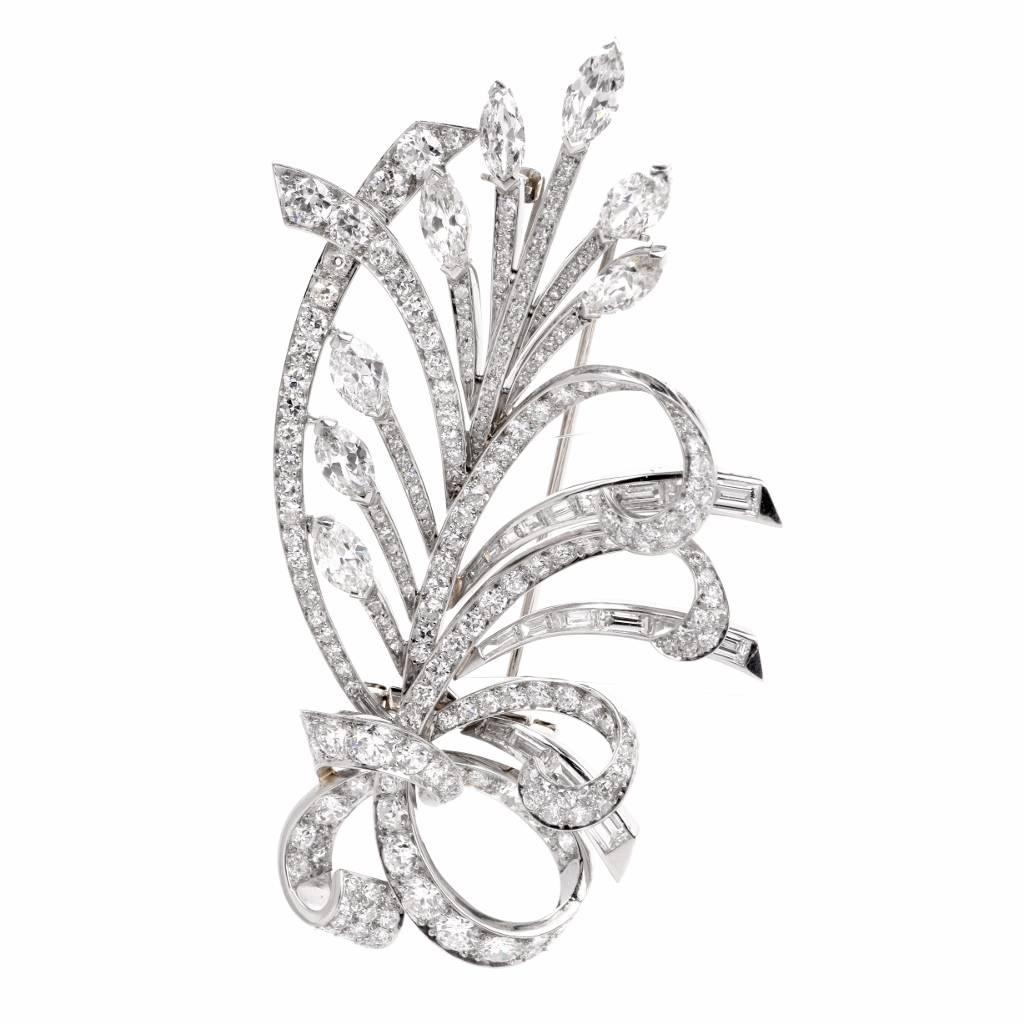 This alluring vintage lapel brooch of opulent aesthetic and unmatched sophistication depicts a most precious bunch of flowers realized in diamonds and platinum. The flowers/buds on this enchanting bouquet are simulated by marquise diamonds approx.