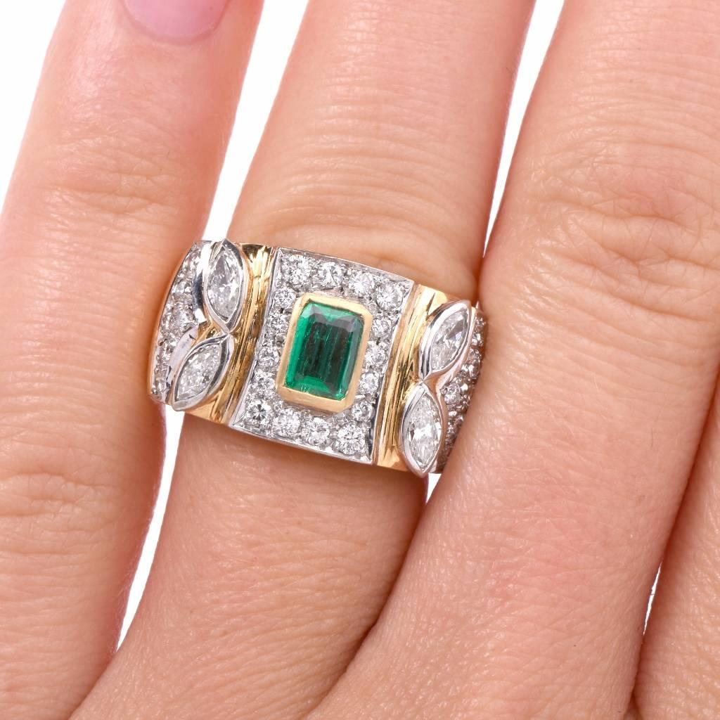 This exquisite ring is centered with 1 genuine high quality Colombian Emerald approx: 0.45cttw, yellow gold bezel set and adorned with 28 genuine round cut Diamonds approx: 0.50cttw, G-H color, VS1-VS2 clarity, and 4 genuine marquise cut Diamonds