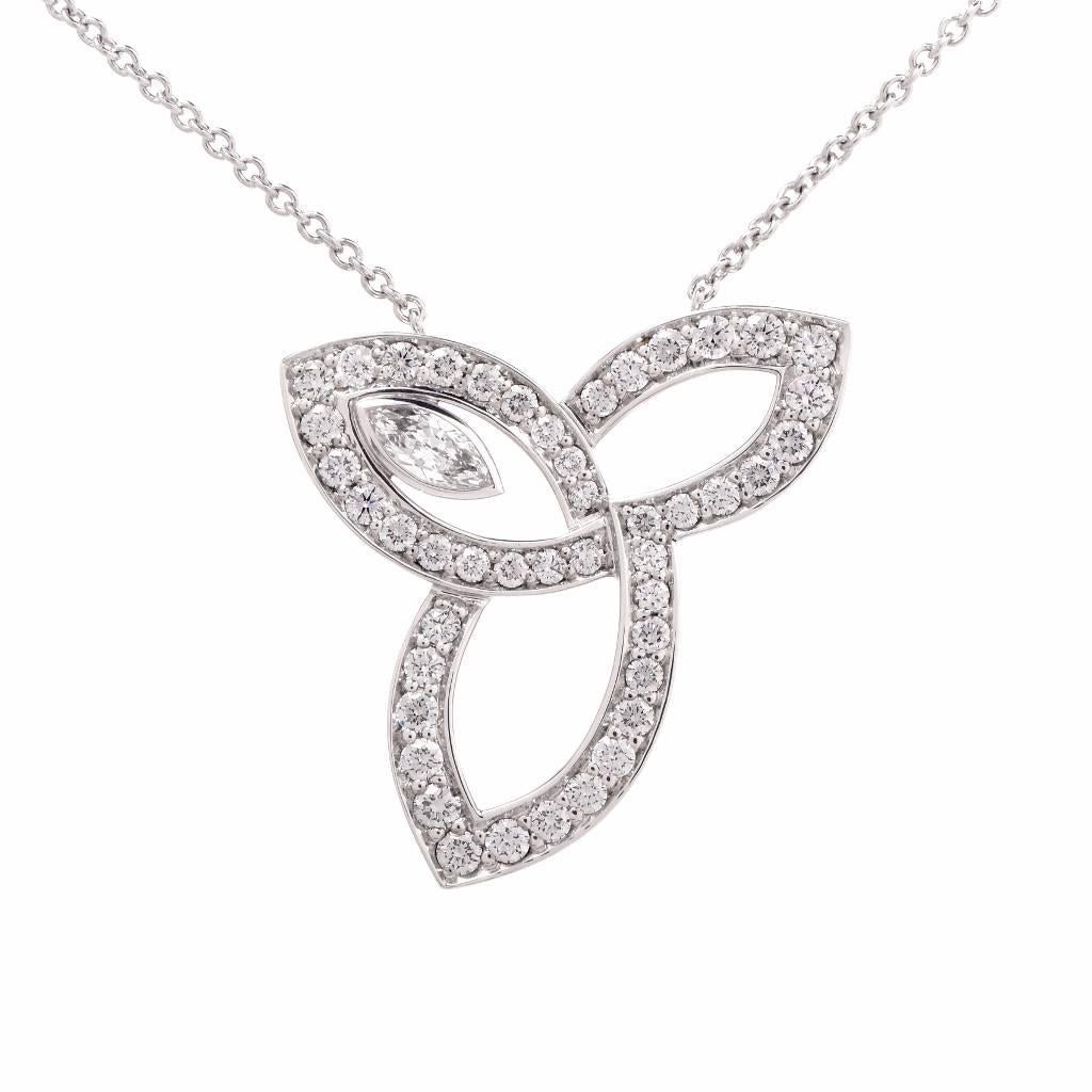 This authentic Harry Winston pendant from the popular Lily Cluster Collection  combines contemporary elegance and tradition Simulating the natural beauty of lilies in bloom, the Lily Cluster collection encompasses a range of items from traditional