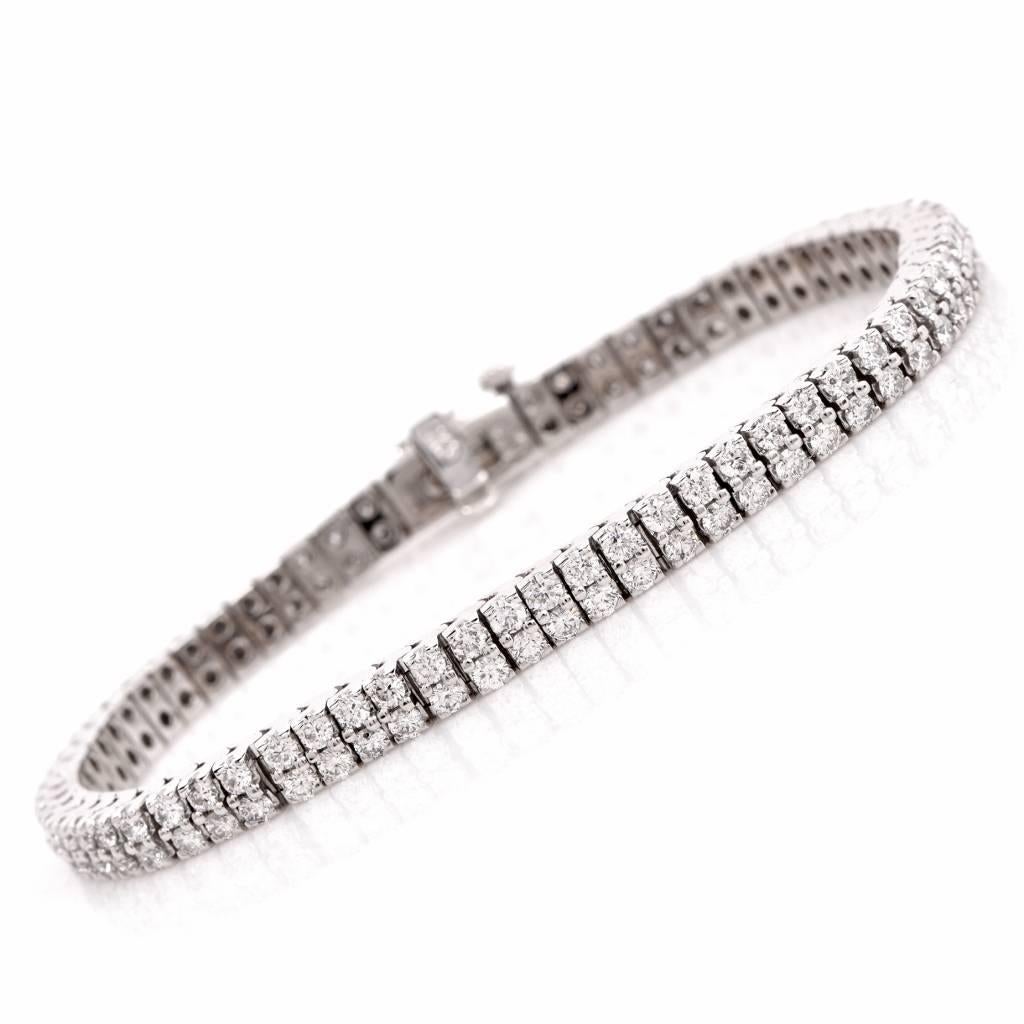 This stylish Tennis  bracelet of Italian provenance is crafted in solid 14K white gold, weighing approx. 23.5 grams and measuring approx. 7" wrist size and 5mm wide. adorned with 136 genuine round-faceted diamonds weighing approx. 6.10cts,