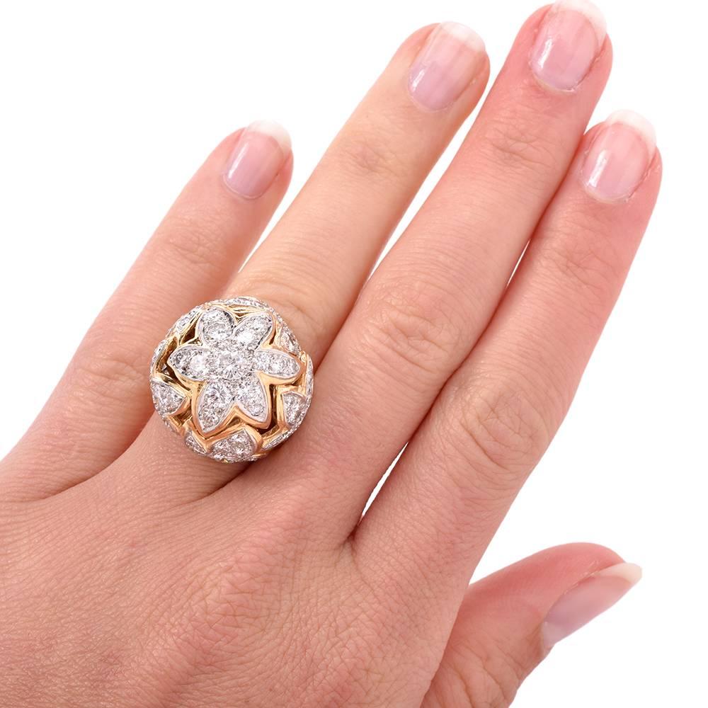 This stunning Retro cocktail ring is crafted in solid 18K yellow gold, elaborately designed as a dome shape plaque, depicting at the top of the high dome an eye-catching diamond-studded flower. this cluster dome ring is  adorned cumulatively with 