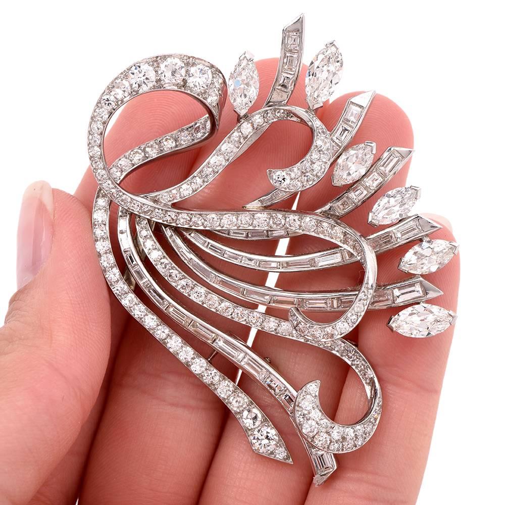 This stunning vintage 1960s  lapel brooch of opulent aesthetic and unmatched sophistication depicts a very precious floral bouquet with  marquise diamonds simulating  flowers and buds and baguette and round-faceted diamonds covering the romantically