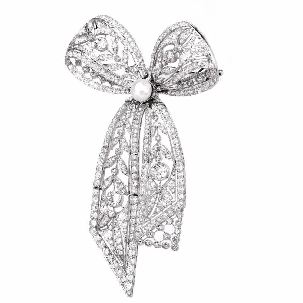 This magnificent Belle Epoque design Edwardian style vintage pin brooch of highly elaborated design and immaculate workmanship is crafted in platinum, weighing 57.9 grams and measuring 4.5 inches long x 3 inches wide. Exuding elegance and beauty,