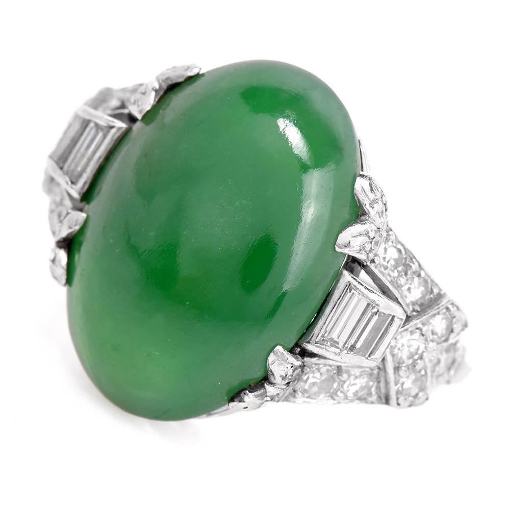 This antique 1930s vintage  ring with a GIA certified jadeite jade, baguette and round-faceted diamonds is crafted in solid platinum, weighing 7.41 grams and measuring 17.5 mm wide. The alluring  GIA graded double cabochon  jadeite jade of