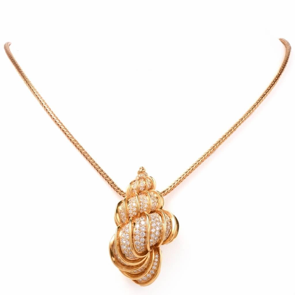 This exquisite and stunning shell necklace is finely crafted by Kurt Wayne in solid 18K yellow gold. The shell pendant is covered in some 291 genuine round cut diamonds approx. 11.00cts, G color, VVS clarity, pave set. This item can be worn as a