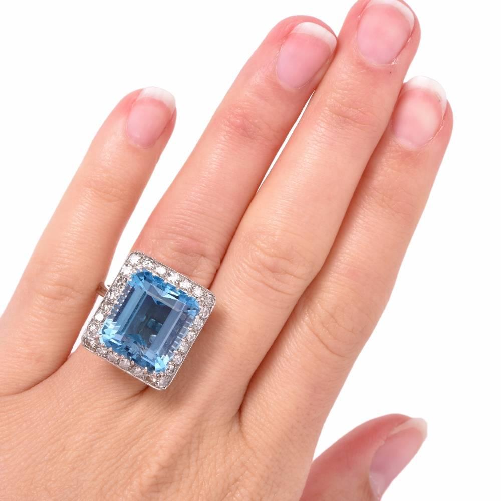 This stunning aquamarine cocktail ring from the 1960s is crafted in platinum and exposes at the center a genuine flawless rectangular emerald-cut aquamarine of approx.16.65 carats, secured by multiple prongs and surrounded by a sparkling diamond