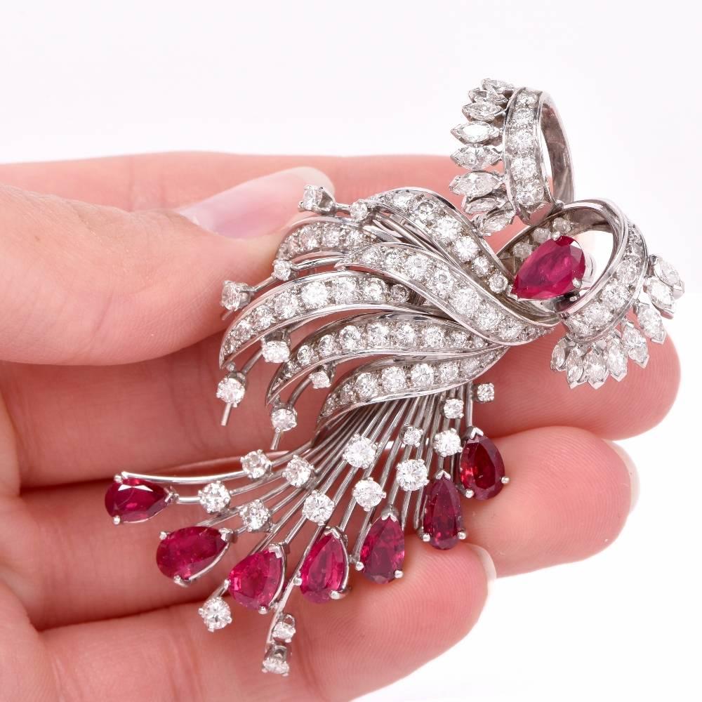 This impressive large cluster Vintage Brooch pin from Retro era is adorned with 8 genuine pear cut natural corundum Rubies approx: 7.20 carats total, prong set; 83 genuine round cut Diamonds approx: 9.12 carats, H-I color, VS clarity, prong set and