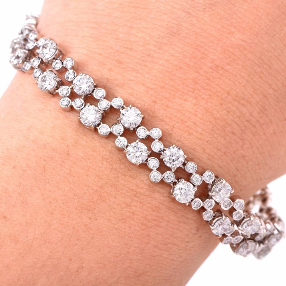 This designer Hearts On Fire diamond bracelet of notable refinement and feminine grace is immaculately handcrafted in solid 18K white gold.  This  sparkling bracelet is enriched with some 32 large high-quality  round-faceted diamonds approximately