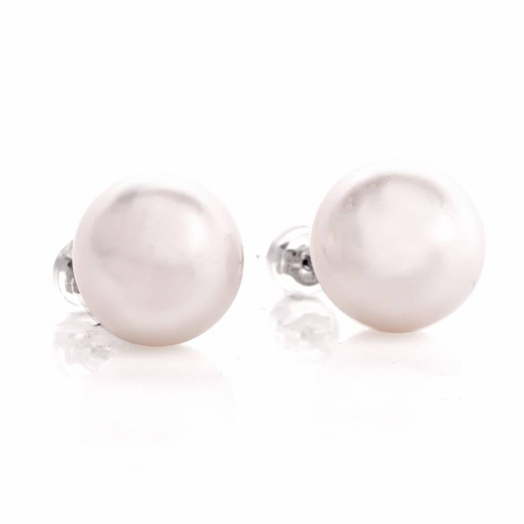 These timelessly elegant South Sea pearl stud earrings are rendered in solid 18K white gold and weigh approximately 7.8 grams. They expose a pair of lustrous South Sea Pearls of ‘white with very subtle pink creme hue’ color ( Hardly ant bemish