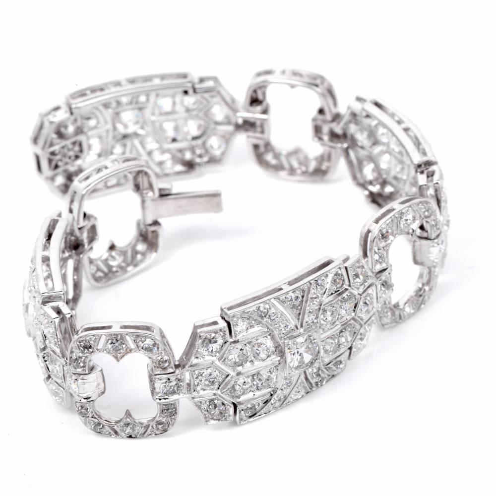 This Antique captivating diamond link bracelet reminiscent of the 1930's most elegant wrist ornaments is crafted in solid platinum. It incorporates four quintessentially Art Deco elongated octagonal plaques of a gracefully convex format, with four