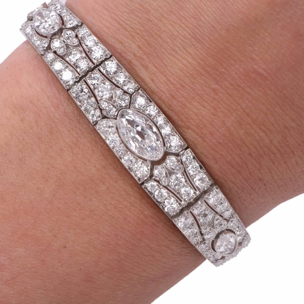 Presenting this breathtaking antique Art Deco 1920’s diamond bracelet, handcrafted in platinum, This quintessentially Art Deco link bracelet exposes a large oval shape European-cut diamond extra white approx. 1.70 carats F-G color, VS1-VS2 Clarity