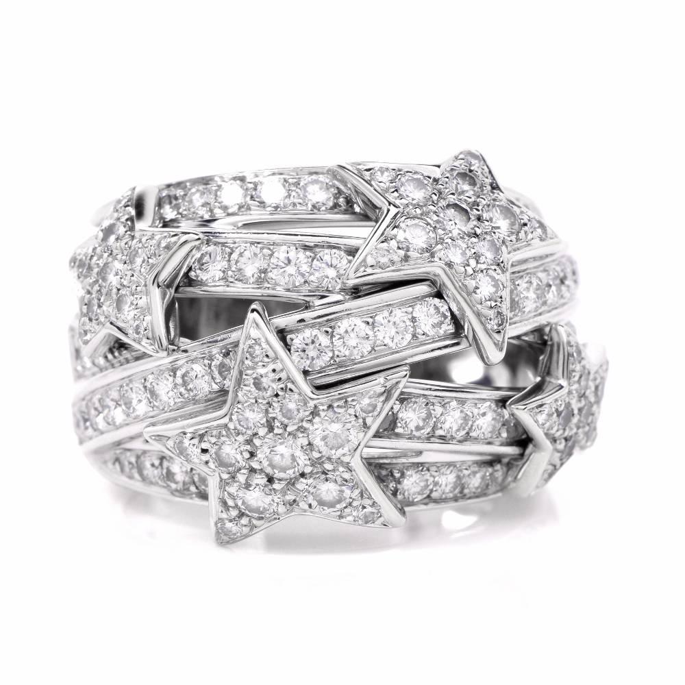 This  authentic Chanel cocktail ring  from Comète collection is crafted in 18k Solid white gold. This astonishing  Depicting an avant-garde design of multiple overlapping diamond bands, constituting a stylized dome plaque, enriched with an