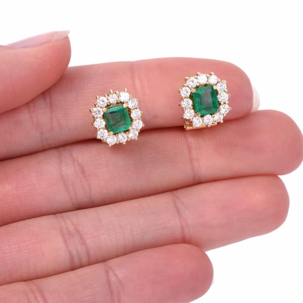 These elegant  clip-back earrings are crafted in solid 18K yellow gold and are centered with 2 genuine emerald cut emeralds with few natural inclusions weighing approx. 1.10 carats . The translucent genuine natural beryls are surrounded each by 12