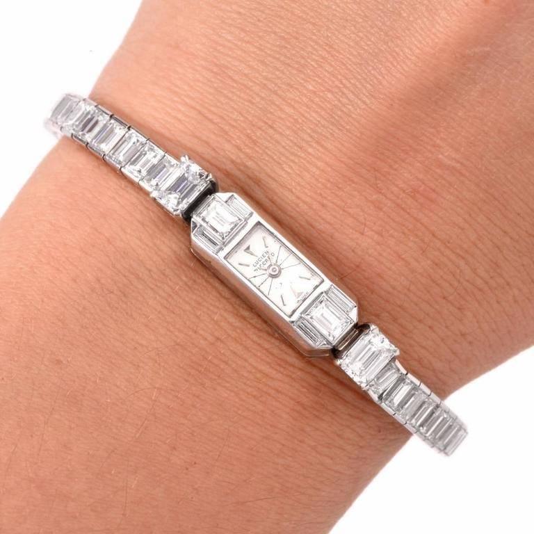 This fine 1960's Lucien Piccard lady's platinum and diamond bracelet watch Accented with 61 baguette cut diamonds approx. 15.30 carats F-G color, VS clarity. The dial is silvered back wind manual movement With Diamond clasp.

Diamond Weight : 15.30
