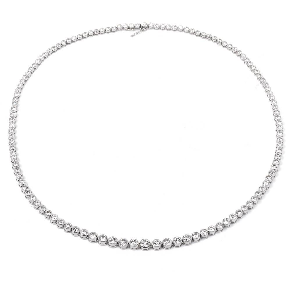This Parrkling Vinatge Platinum diamond  Riviera Tennis necklace circa 1960's featuring 111 round brilliant cut diamonds, extra white and clean, bazel set weighing 9.50 carats G to H  color VS1 clarity eith few SI clarity.  
The necklace measures