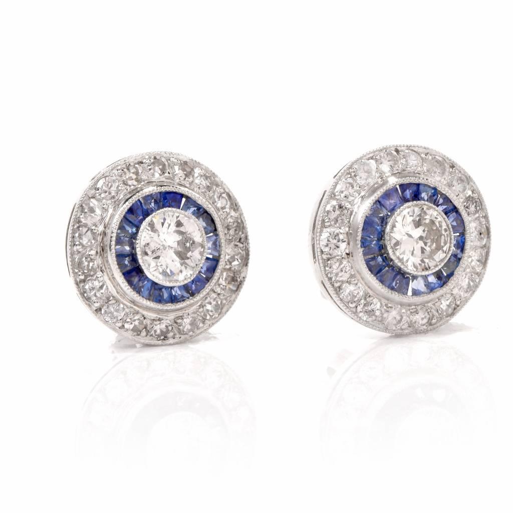 These Esate Art Deco style earrings are crafted in platinum and incorporate each a pair of circular plaques measuring 12 mm in diameter. The sparkling centrally positioned TWO diamonds weigh cumulatively 0.50 cts and are gradedcarats H-I color and
