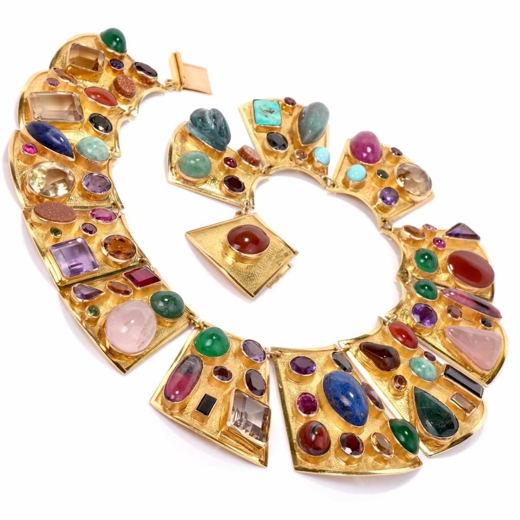 Multi gemstone Egyptian inspired necklace is hand crafted in elegantly matted 18K yellow gold. This timeless 1970's  necklace displays an exquisite Egyptian inspired design and depicts a rich palette of colors comprising a variety of semiprecious