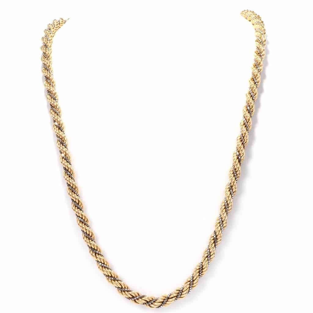 This Lovely fashionable long chain necklace of classic elegance is rendered in a combination of 18K polished yellow and white gold. Designed alluringly with a twisted rope pattern, the desiarable 32-inch long necklace is intertwined with delicate
