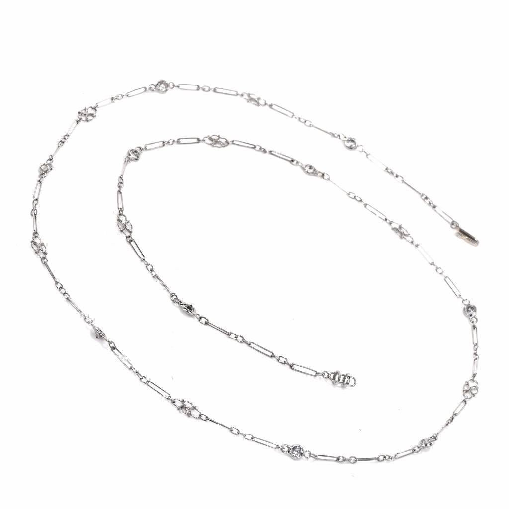 This delicate hand made Art Deco design diamond chain necklace is crafted in solid platinum, measures 18 inches long, and is adorned with 10 round-faceted diamonds. The precious stones weigh cumulatively 0.50 carats and are graded H-I color and