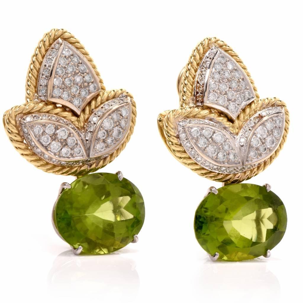 These botanical inspired earrings crafted in solid 18K yellow and white gold, weighing 28.1 grams. These earrings feature a yellow gold rope contour and leave motif. Centered with 2 genuine oval cut Peridot approx: 26.16 carats and accented with 160