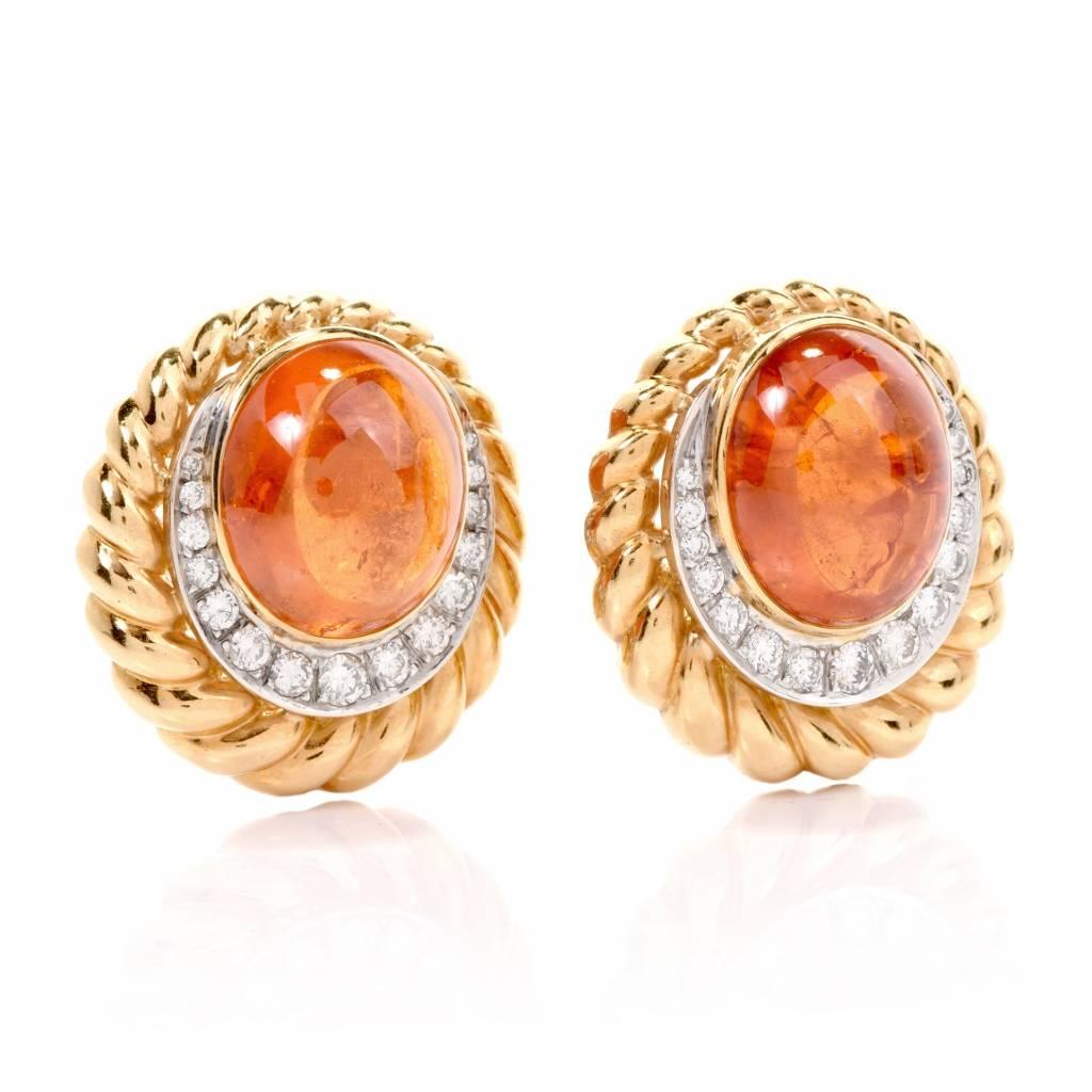 1970's Spessartite Garnet 18K Gold Dimaond Clipback Back Earrings,.These Stylish Estate spessartite garnet and diamond  earrings are crafted in solid 18K yellow gold with a touch of white gold applied to diamond settings.
Displaying feminine grace