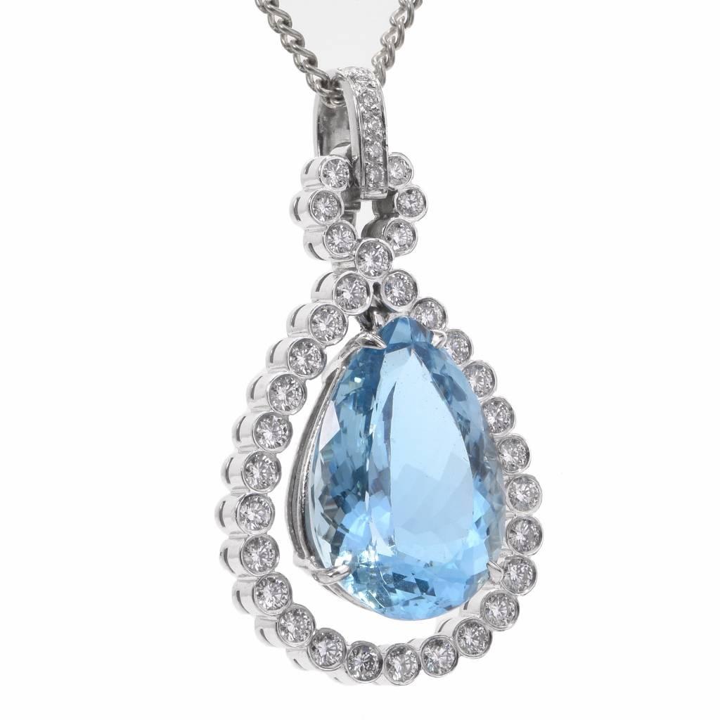 This dazzling Estate diamond & aquamarine dangle drop pendant is handcrafted in solid 18K white gold.
This enchanting pendant is centered with 1 genuine ocean-blue pear cut Aquamarine approx: 13.48 carats, prong set, and is furthermore