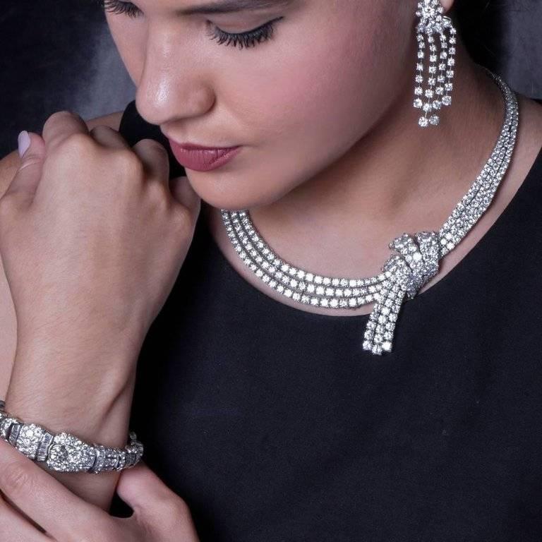 This luxurious necklace is crafted in solid platinum. It is covered in approx. 375 variously sized round and marquise diamonds, all weighing 73.00 carats, graded G-H color and VS1-VS2 clarity. It is adorned with a well designed and side-positioned