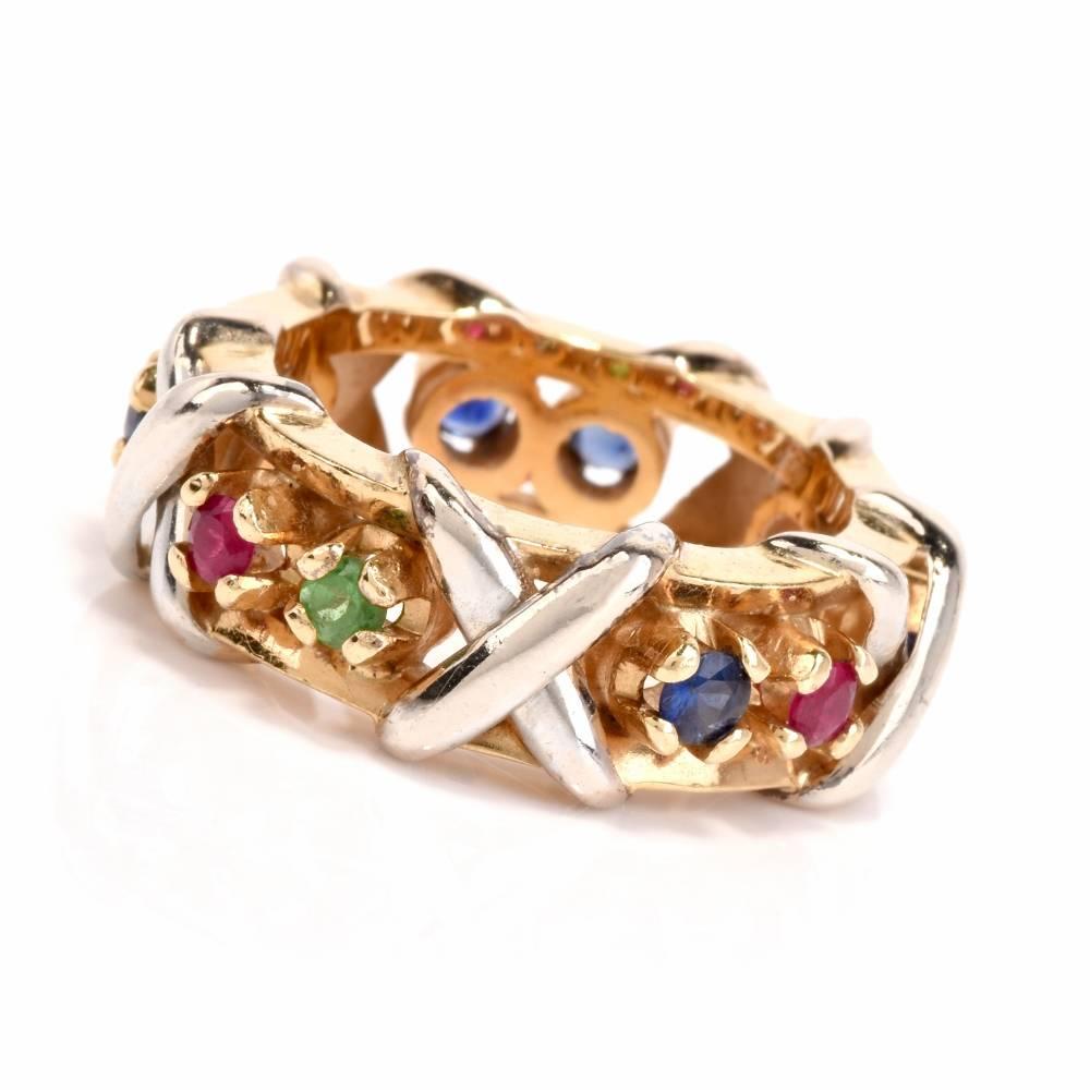 This estate multi-gem band ring of vivacious aesthetic is crafted in a combination of 18-karat yellow and white gold. Immaculately designed as a three-dimensional band ring, it is adorned with 5 round-faceted bluew sapphires, 2 faceted pink