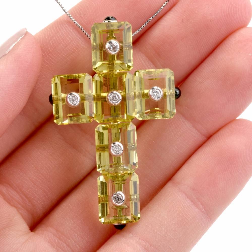 

This stylish cross pendant incorporates 6 rectangular-cut lemon topaz gems, pin-set approx. 35.00 carats.  They are adorned by a  total number of 6 round-faceted diamonds, cumulatively weighing 0.12carats, graded H-I color and VS clarity. A number
