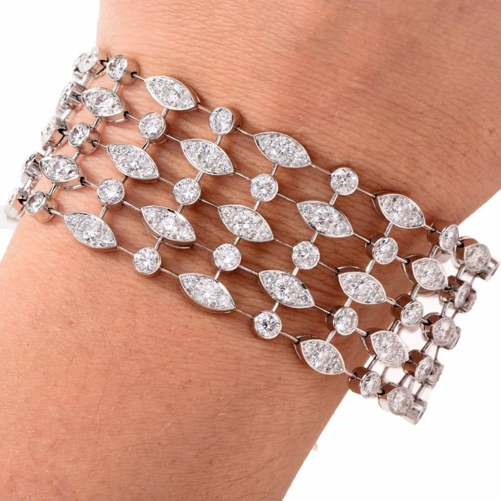 This stunning multi strand bracelet is authentic Cartier  from “Naiade” Collection, and is handcrafted in solid 18K white gold.

It displays a 5 strand geometrical design conformed by marquise and round links, such links are adorned with 200 genuine
