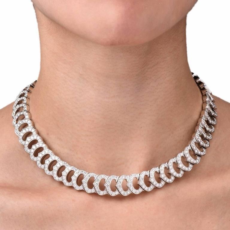 We are proud to present an 18K white gold diamond C de Cartier necklace by Cartier. This is a rare vintage necklace and it is no longer in production. It is crafted in solid 18K white gold, composed of 54 diamond-encrusted diamond crown motif