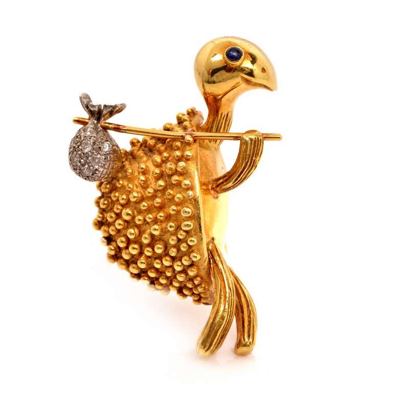 This enchanting vintage turtle brooch is crafted in 18k yellow gold with minimal application of white gold, weighs 23.4 grams and measures 2