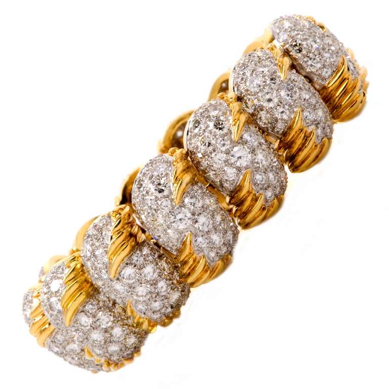 This vintage Retro bracelet of opulent and impressive designer Hammerman Brothers, bearing the signature 'Hammerman' on the sturdy clasp. This highly ornate bracelet is crafted in solid 18K yellow gold and solid platinum weighs approx. 96.00 grams