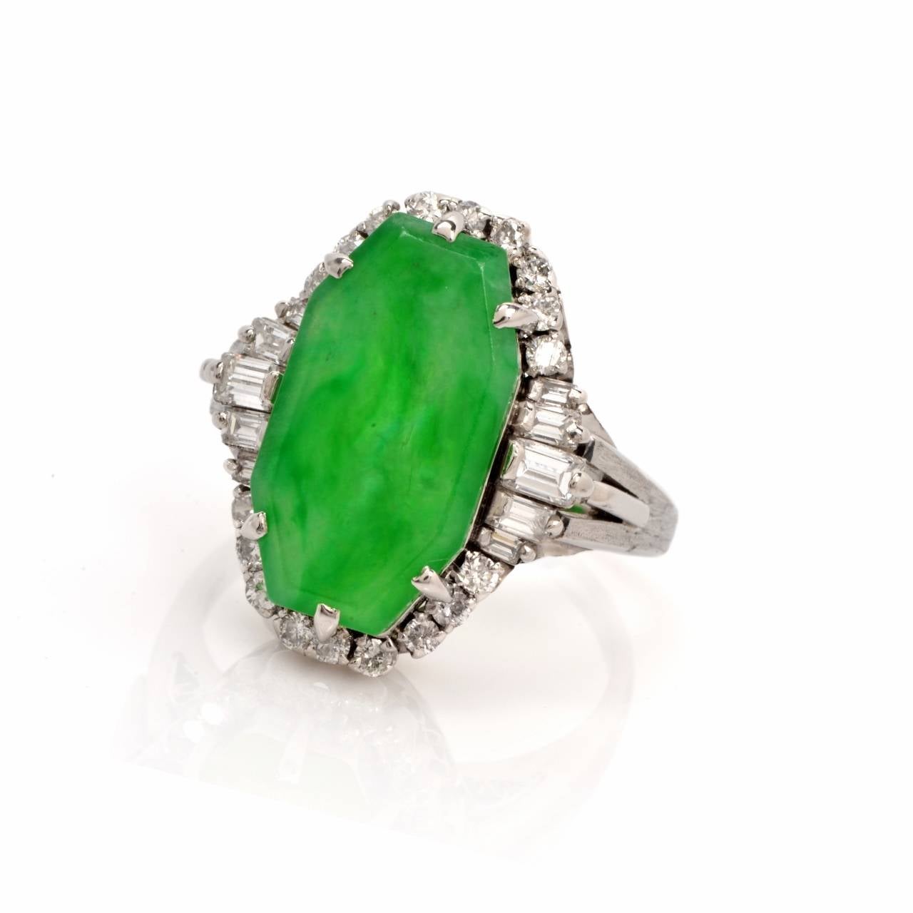 This captivating estate cocktail ring of enchanting aesthetic is crafted in solid platinum, weighing 11.29 grams. Incorporating a color-contrasted octagonal plaque, it is centered with a GIA certified octagonal-carved natural (untreated) green