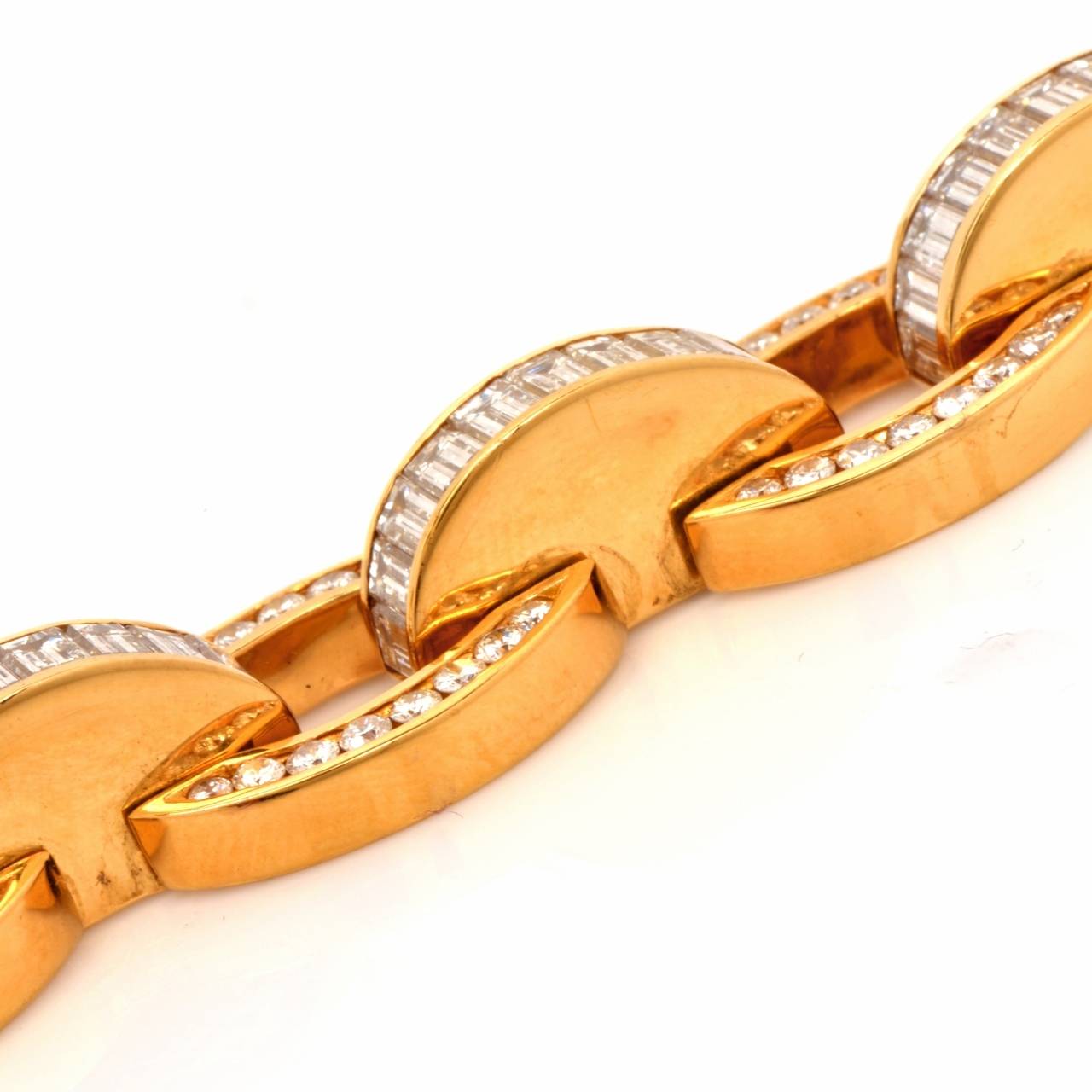 This Stunning 1980's designer Charles Krypell estate bracelet exposes an assemblage of ovular links and alternately juxtaposed crescent shaped silhouettes. The classically elegant bracelet is crafted in solid 18K yellow gold, weighs approx. 61.8 