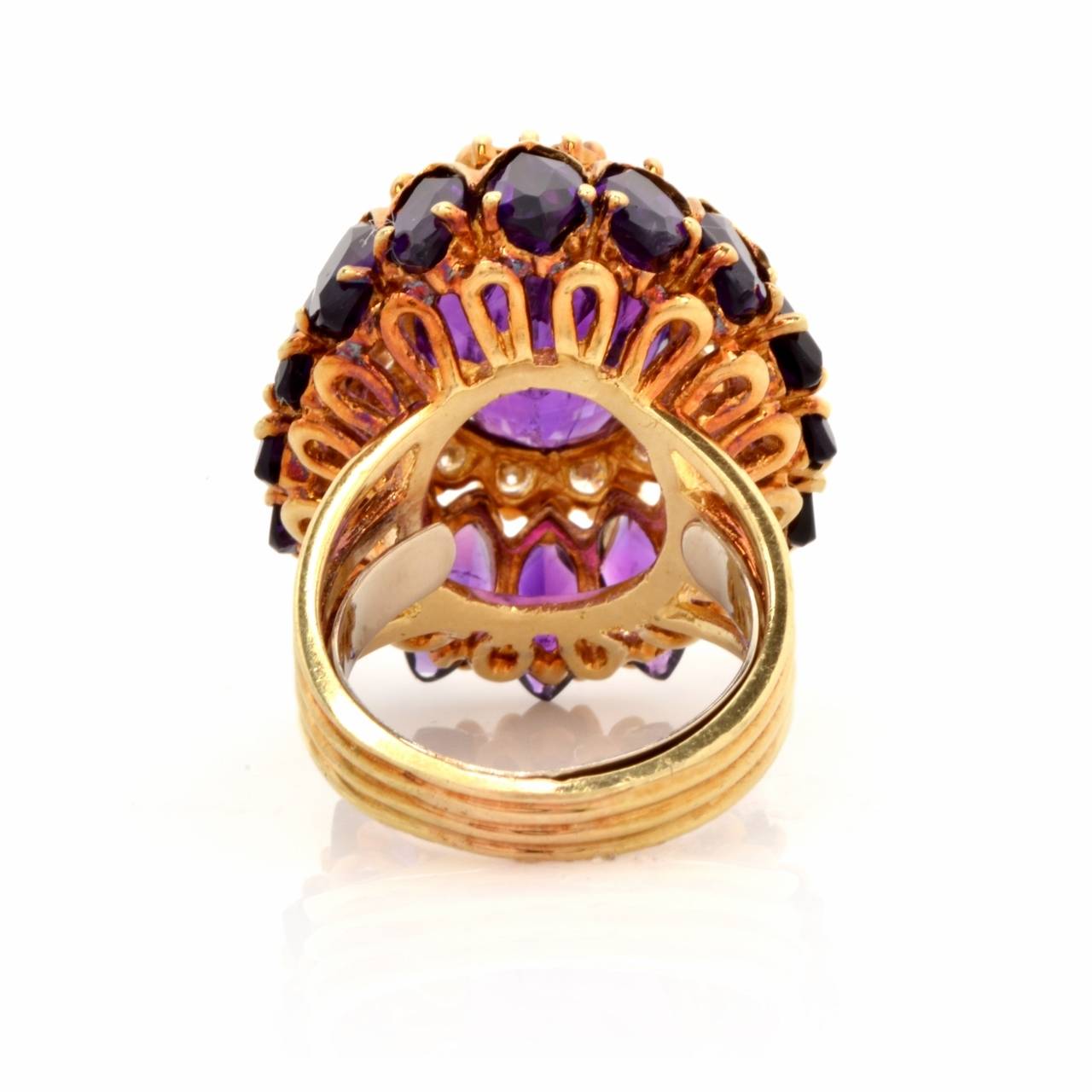 This astonishing vintage Retro cocktail ring of elaborate design and immaculate workmanship is crafted in 18K yellow gold, weighing 18.8 grams and measuring 30 mm x 25 mm x 15 mm. Artfully designed as a multiple  layer ovular plaque., this