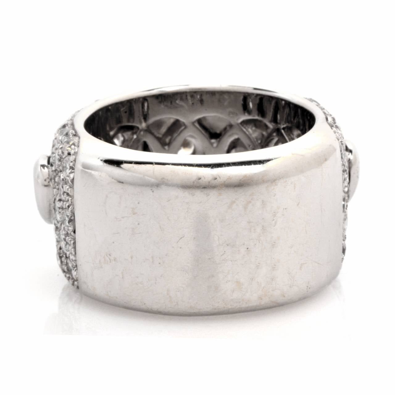 This affluent estate wide  band ring of elegant monochromatic aesthetic is of Italian provenance, crafted in solid 18K white gold, weighing 16.7 grams and measuring 13 mm wide. This alluring band ring is enriched with 158 pave-set round faceted