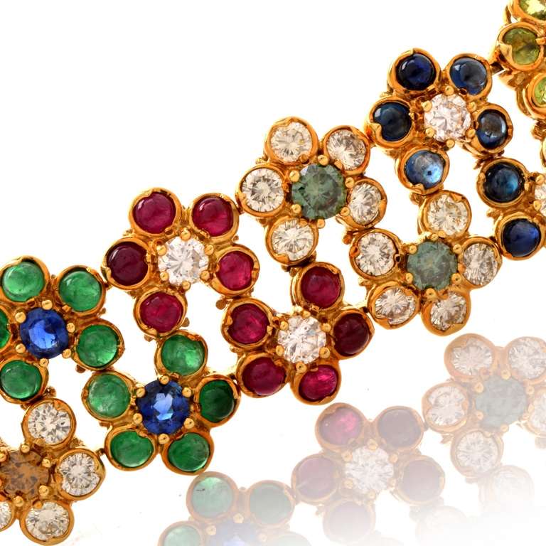 This vivacious bracelet resplendent in multiple precious and semi-precious gemstones is crafted in solid 18K yellow gold, weighs approx. 105.9 grams and measures approx. 8