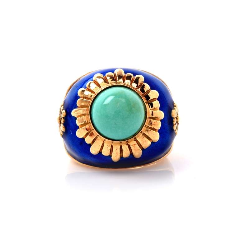 This alluring Retro style cocktail ring with a turquoise cabochon is crafted in solid 18K yellow gold, weighing approx. 19.5 grams and 15mm high. Designed as a gracefully domed plaque, this colorful ring is centered with an enchanting turquoise
