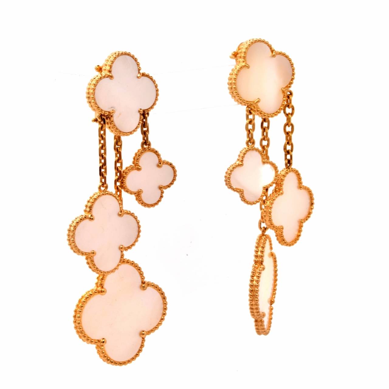 These exquisite French drop dangle earrings are crafted in solid 18K yellow gold by Designer Van Cleef & Arpels VCA from the collection 'Alhambra. ' These earrings feature a stylish link design along various strands that are adorned with a four leaf