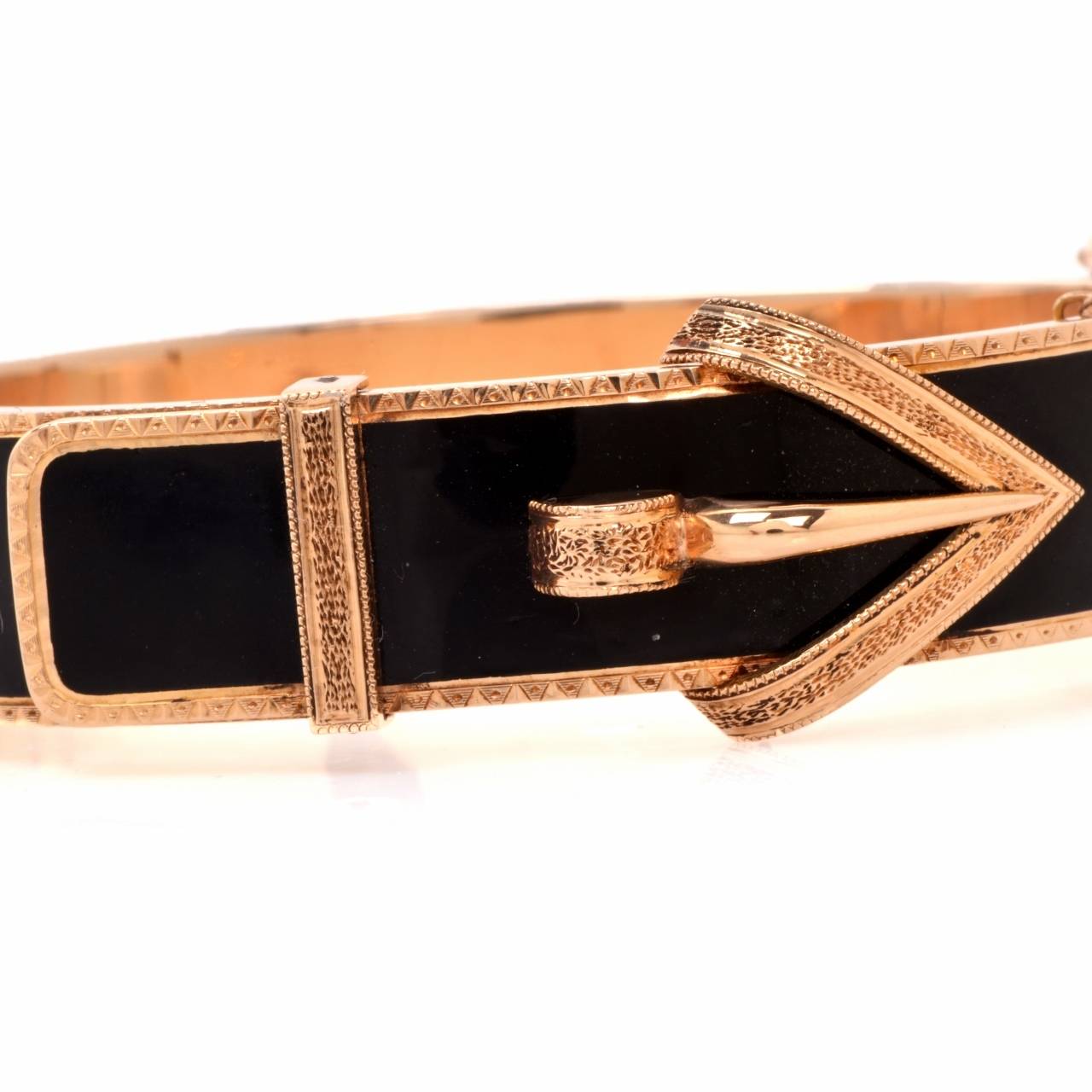 This gorgeous Antique belt buckle bangle bracelet is crafted in solid 14 K yellow gold metal. Showcasing a stylish and feminine belt buckle design that is covered with black enamel.  With a security insert clasp, this bracelet remains in very good
