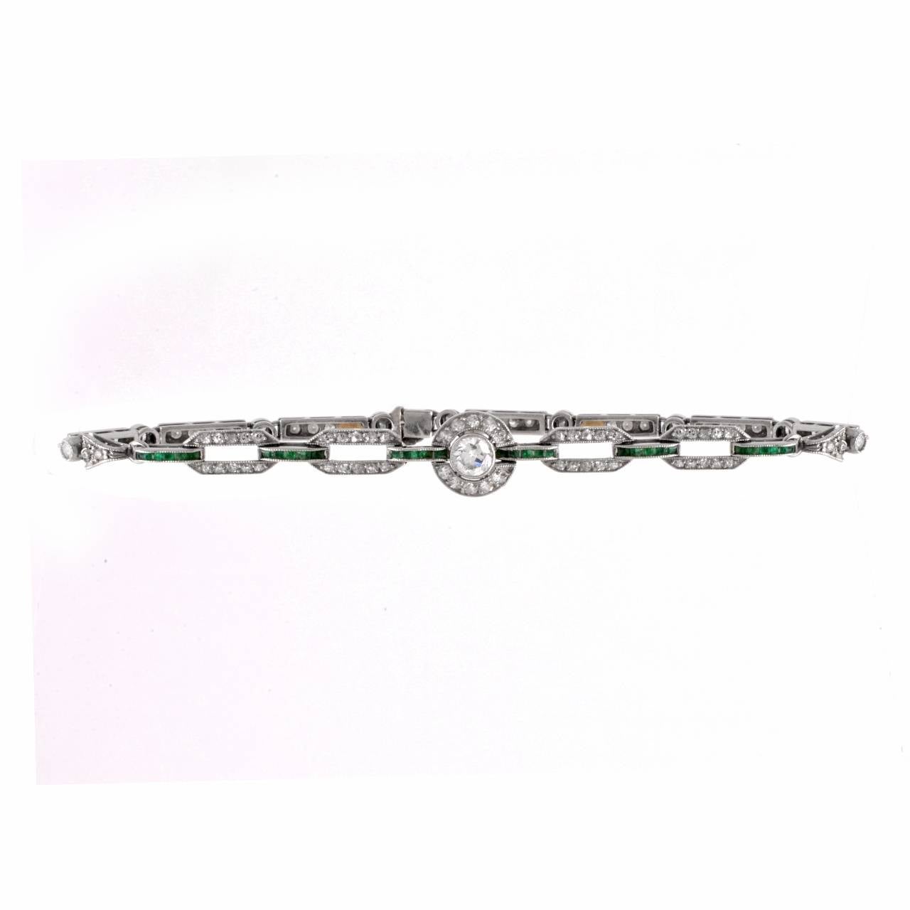 This lovely  Art Deco bracelet  is crafted in solid platinum and  incorporates flexible geometric links. Set at the center is a 0.20 ct round-faceted diamond graded H-I color and VS clarity, surrounded by pave diamonds. This bracelet is cumulatively