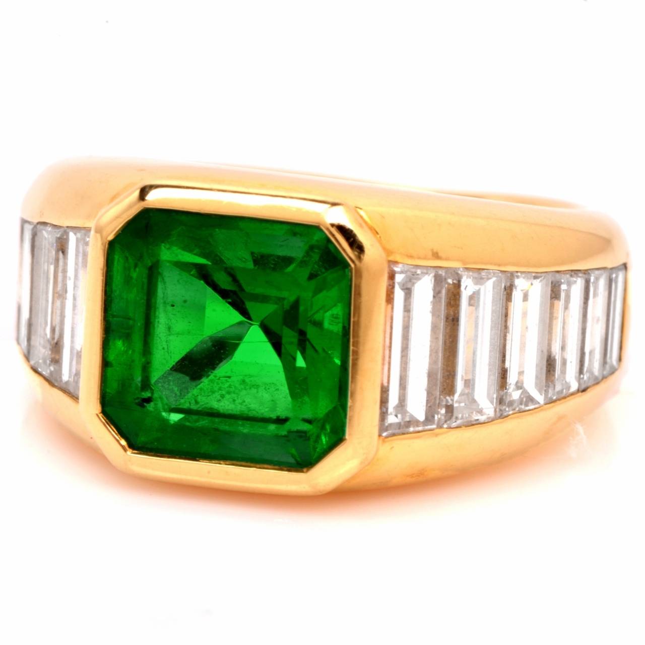 Dover Jewelry presents this Tiffany & Co. ring with GIA certificate (GIA Report # 2175130238) crafted in solid 18K yellow gold.

The Colombian emerald of transparent intense green color extremely high quality measures 8.24 x 8.15 x 5.87 mm,