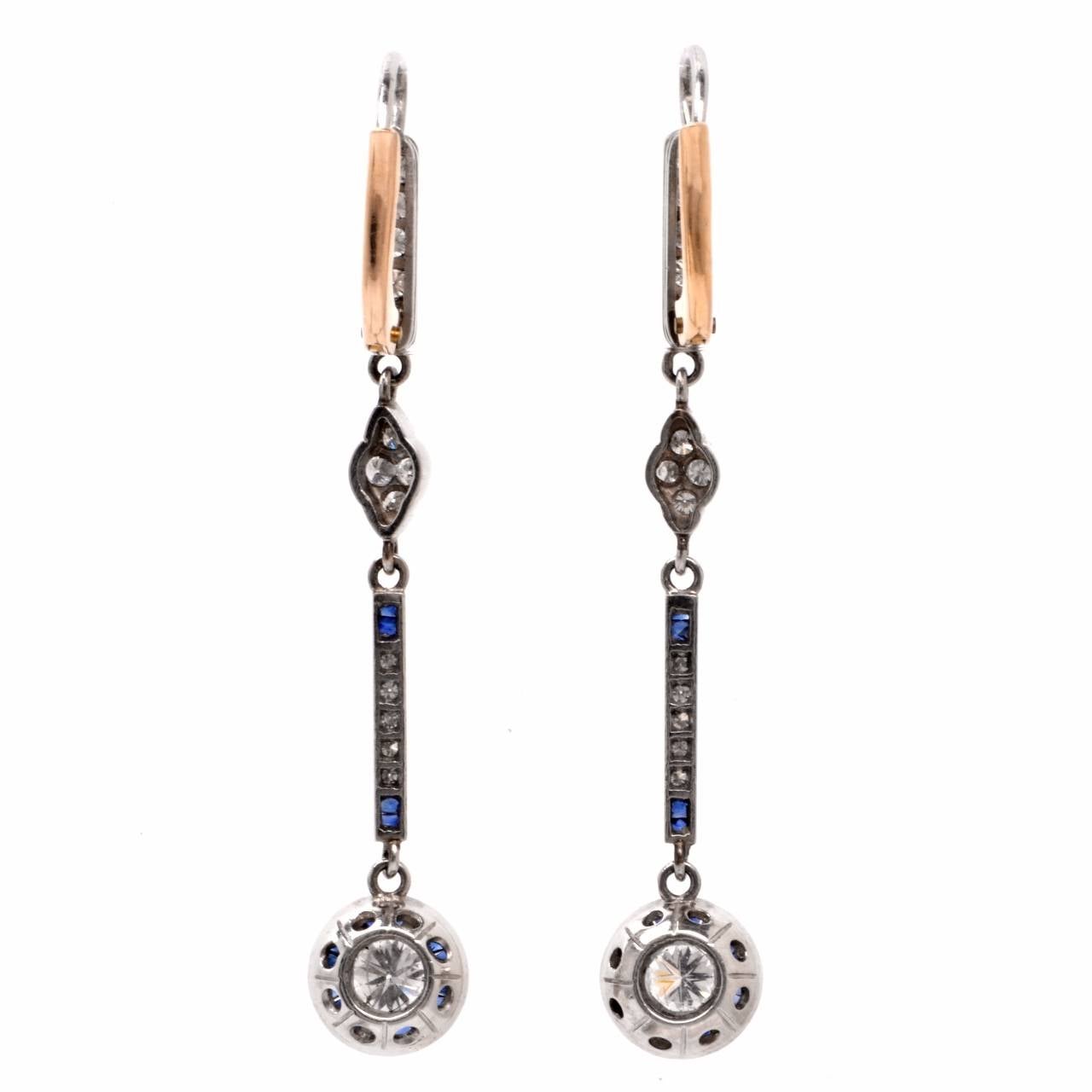 These vintage Art Deco pendant earrings  of  classic elegance are crafted in platinum with a touch of 18 yellow gold applied to French lever-backs. They weigh 6.3 grams and measure 2