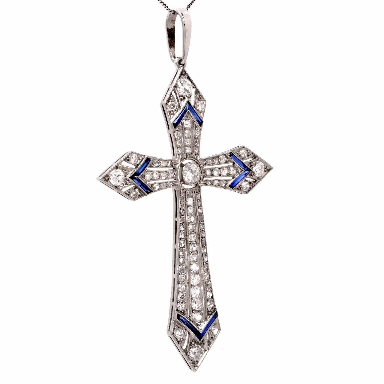 This stunning antique  Art Deco  diamond  and sapphire cross pendant of immaculate workmanship  is crafted in solid platinum, exposing at the center a sparkling European round-faceted diamond  weighing approx: 0.20cts, graded  G-H color,  VS